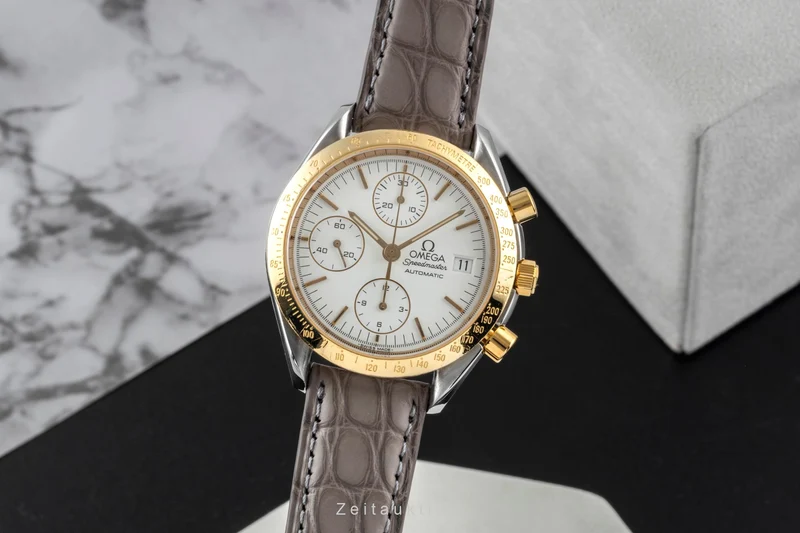 Omega Speedmaster Date chronograph steel / gold automatic men's watch 3311.20 LP: 8200EUR [2600526]