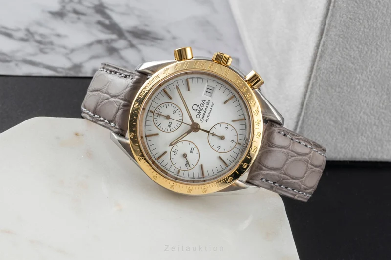 Omega Speedmaster Date chronograph steel / gold automatic men's watch 3311.20 LP: 8200EUR [2600526]