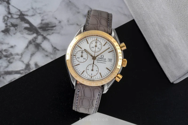 Omega Speedmaster Date chronograph steel / gold automatic men's watch 3311.20 LP: 8200EUR [2600526]