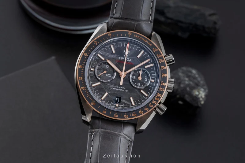 Omega Speedmaster Moonwatch chronograph ceramic / gold automatic men's watch 311.63.44.51.99.001 LP: 15900EUR [2506570]