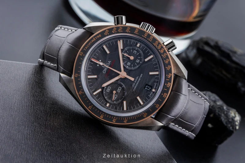 Omega Speedmaster Moonwatch chronograph ceramic / gold automatic men's watch 311.63.44.51.99.001 LP: 15900EUR [2506570]