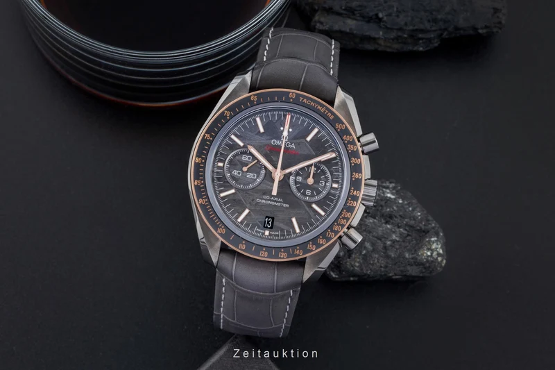 Omega Speedmaster Moonwatch chronograph ceramic / gold automatic men's watch 311.63.44.51.99.001 LP: 15900EUR [2506570]